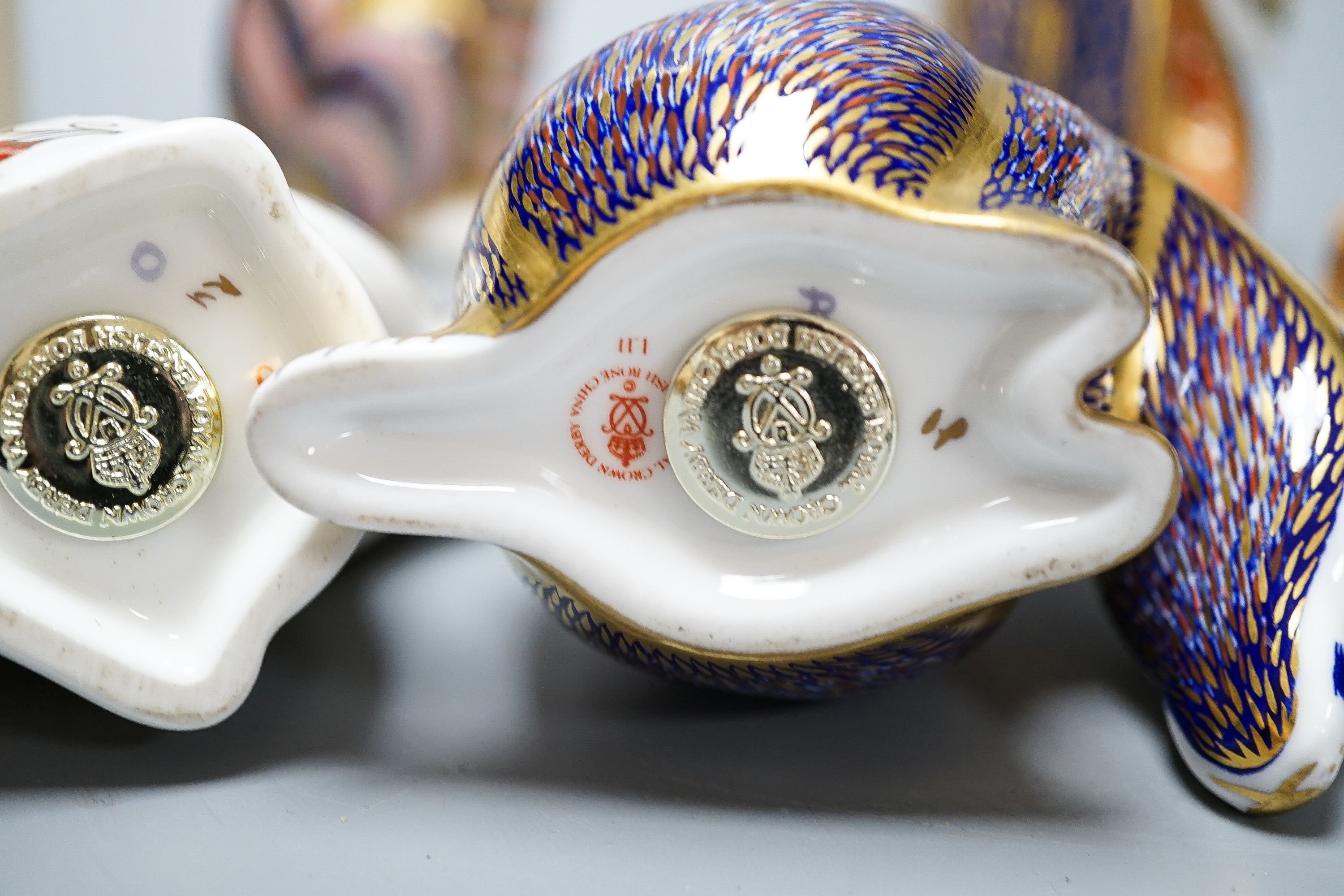 Four Royal Crown Derby paperweights, a Royal Doulton jug, a Belleek jug and a Wedgwood Noah’s ark collection hare